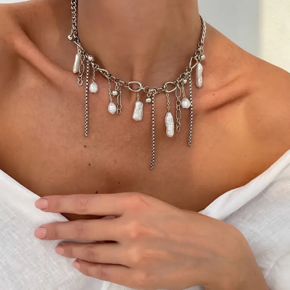 NWOT Elegant Silver Necklace with Dangling Charms